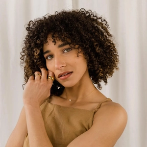 Elegant s925 sterling silver gold-plated necklace and ring set worn by a female model