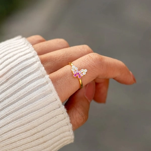 Minimalist S925 silver ring featuring a golden butterfly with pink and white zircon stones