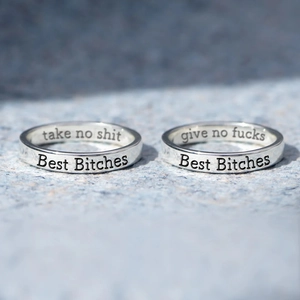 Pair of S925 sterling silver rings engraved with Take No Shit and Best Bitches text