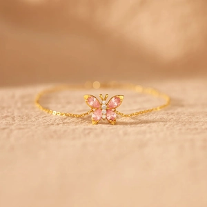 Elegant S925 silver gold bracelet featuring a pink cubic zirconia butterfly pendant
