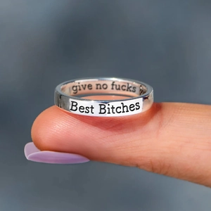 Macro shot of S925 sterling silver ring with Best Bitches and give no fucks engraving