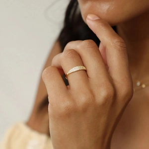Minimalist s925 silver gold ring with pavé set cubic zirconia shown on model finger