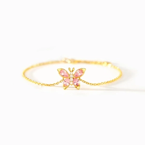 S925 sterling silver gold bracelet with pink zircon butterfly pendant on white background
