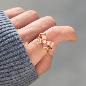 Rose gold S925 sterling silver bow ring with square gemstone worn by model