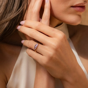 Elegant gold S925 silver ring featuring three rectangular light purple zircon gemstones