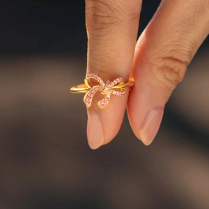 Elegant S925 sterling silver bow ring featuring gradient pink cubic zirconia stones