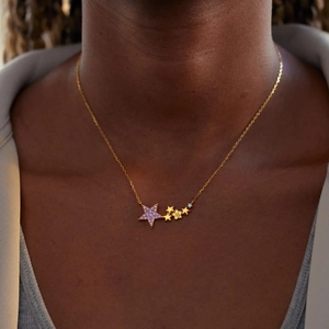 Close-up of S925 silver star necklace with purple and blue stones on gold-plated chain