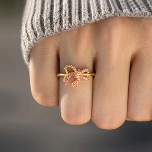 S925 sterling silver bow ring with pink gradient zircon stones on a gold-plated band