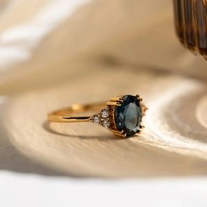 Elegant S925 silver ring with oval deep blue sapphire and sparkling side diamonds