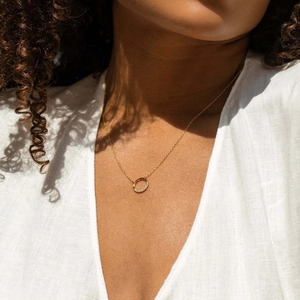 Elegant S925 silver gold-plated circle necklace with sparkling zircons on a model