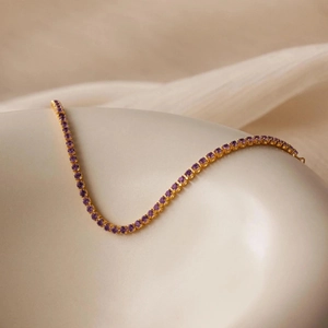 Elegant gold S925 silver tennis bracelet featuring radiant round purple zircons