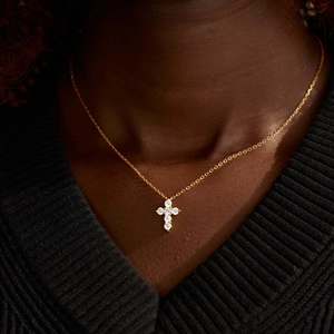 Elegant gold S925 sterling silver cross necklace with zircons worn on female model