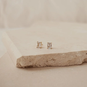 Minimalist S925 silver emerald cut zircon stud earrings with gold plating on stone base