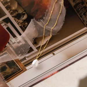 Golden S925 silver chain necklace with a large white freshwater baroque pearl pendant