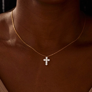 Elegant s925 sterling silver gold cross necklace with sparkling zircon on a female model