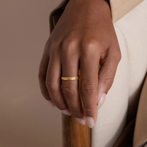 Elegant s925 silver gold plated ring with vintage engraved patterns on woman's hand