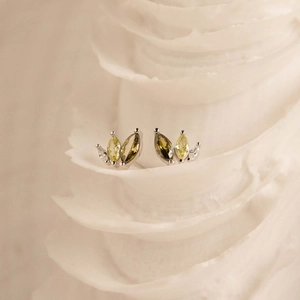 S925 sterling silver marquise-cut green zircon stud earrings on elegant shell texture
