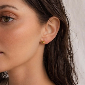 Elegant gold butterfly stud earrings with olive green marquise stones and zircon accents
