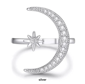 Close-up of S925 sterling silver moon and star ring with sparkling cubic zirconia inlay