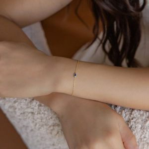S925 sterling silver gold bracelet with a minimalist blue rectangle birthstone