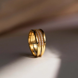 Elegant gold multi-layer X-shaped ring featuring double-row pave-set cubic zirconia stones