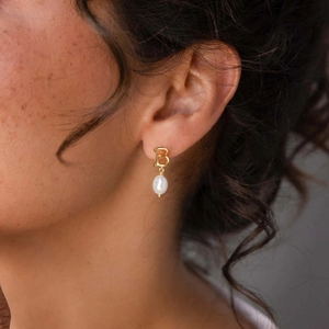 Elegant gold plated S925 silver letter B drop earrings with teardrop pearl on model