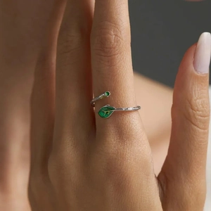 S925 sterling silver adjustable branch ring with green enamel leaves on a finger
