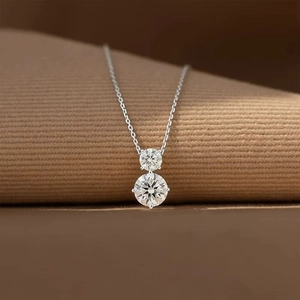Minimalist S925 sterling silver necklace featuring two round brilliant-cut CZ stones