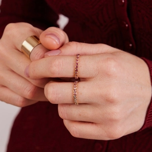 Elegant gold S925 silver ring featuring gradient pink heart-shaped stones in a row