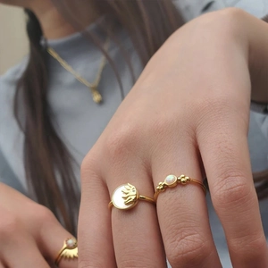 Three-piece gold plated sun and opal ring set for women in a stylish bohemian design
