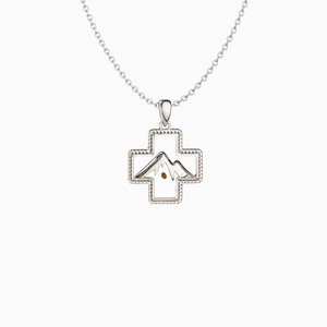 Detailed macro view of S925 silver cross pendant with mountain motif and seed charm