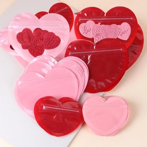 Heart-shaped PVC jewelry pouches with leak-proof zipper in red and pink colors