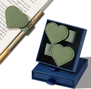 Close-up of sage green heart leather pen loop with elastic band and gold pen detail