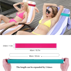 Pink and teal elastic beach towel bands for pool chairs showing stretchable size 40-90cm