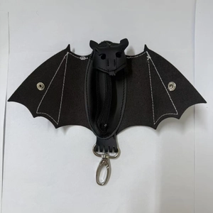 Handmade black leather bat coin purse with white stitching and silver snap closure