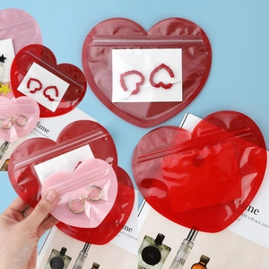 Detail of red and pink heart-shaped PVC jewelry seal bags for Valentine's Day packaging