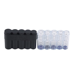Detail view of 5-slot portable coin organizer in matte black and transparent plastic