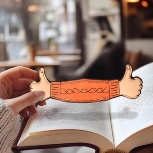 Creative orange PU leather thumb-up magnetic bookmark showing finger knit texture on a book