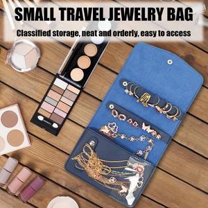 Foldable travel jewelry organizer roll in peacock blue suede with transparent PVC pockets