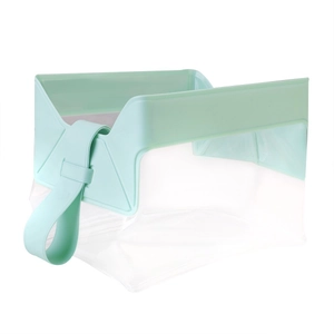 Close-up of mint green PVC trim and transparent travel cosmetic bag with sturdy handle