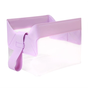 Macro view of transparent PVC toiletry bag with light purple handle and magnetic closure