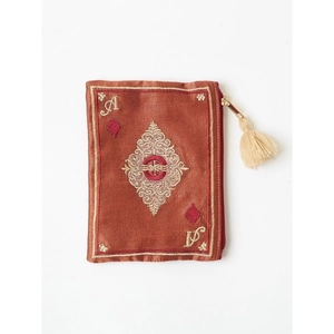 Detail of embroidered Ace of Diamonds on silk pouch with vintage tassel accessory