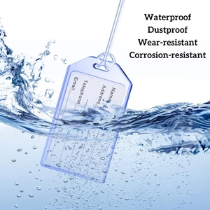 Waterproof blue transparent PVC luggage tag submerged in water with visible bubbles