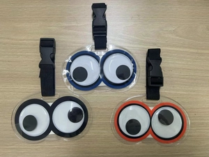 Three-piece PVC luggage tags with moving eyes and durable nylon straps in blue black and orange