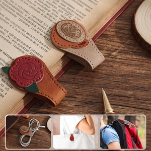 Detail of vintage leather magnetic bookmarks used as cord organizers on bags and books