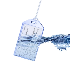 Waterproof blue transparent luggage tag with information card splashing in water