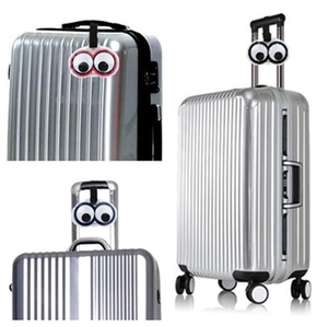 Creative PVC luggage tags with cartoon eyes and nylon straps for easy travel identification