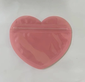 Pink heart-shaped PVC self-sealing bag for jewelry and Valentine gift packaging