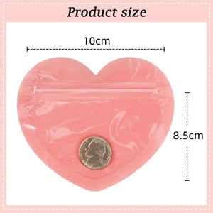 Pink heart-shaped PVC jewelry seal bag 10x8.5cm with coin for scale reference