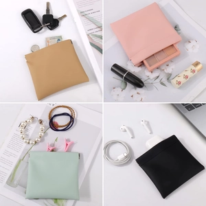 Portable PU leather cosmetic bag with automatic closure shown in four elegant colors